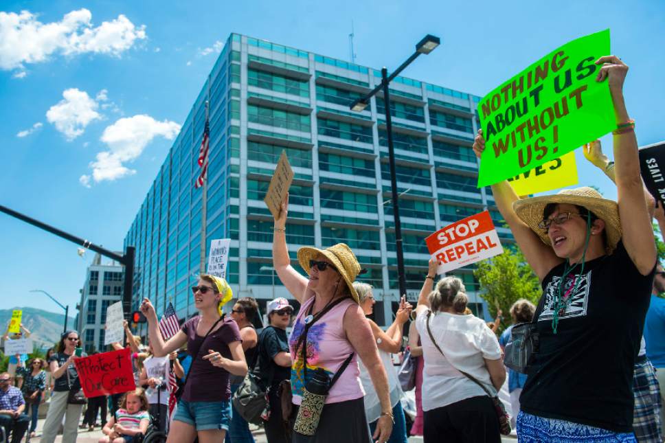 Chris Detrick  |  The Salt Lake Tribune
Protesters participate in a rally against the Senate GOP health care bill outside the Wallace Bennett Federal Building on Tuesday, June 27, 2017.